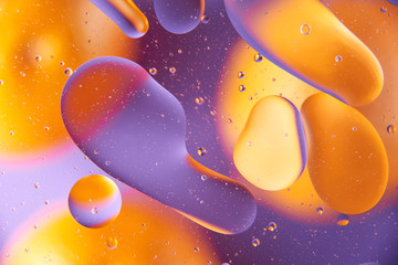 abstract background oil drops on water macro orange