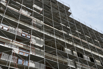 new building under construction, scaffolding and concrete