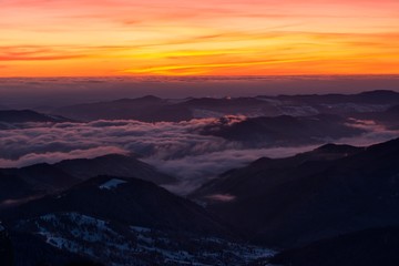 Amazing sunrise in Ceahlau mountains, winter landscape.