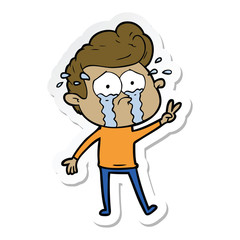 sticker of a cartoon crying man