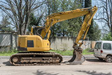 Asphalt machine that is on the road and is ready to work.