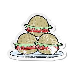 retro distressed sticker of a cartoon plate of burgers