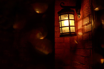 Lantern hanging a brick wall
