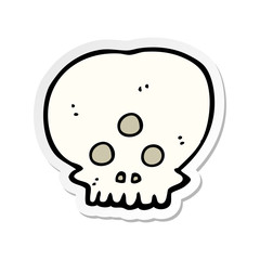 sticker of a cartoon mystic skull