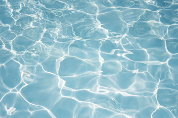 Texture of water in swimming pool for background