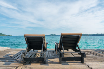 Perfect summer tropical paradise beach with lounge chairs at resort in Phuket, Thailand. Vacation summer holidays and travel concept.