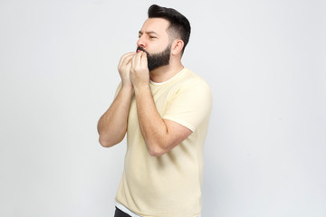 The pretty bearded man shows emotionally