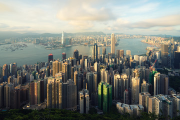 Aerial view of Hong Kong skyline and Victoria Harbor with blue sky in Hong Kong. Asia..