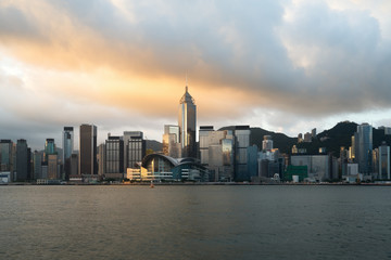Hong Kong skyline with sunlight in the morning over Victoria Harbour in Hong Kong.