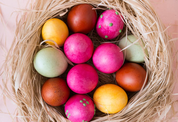 many painted Easter eggs in the nest