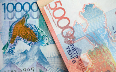 Paper money tenge Kazakhstan, five thousand, ten thousand, background for business.