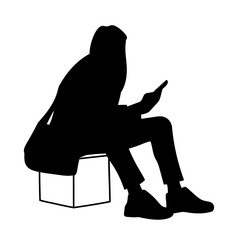 Woman sitting on box, looking at mobile phone. Vector illustration of black silhouette of girl checking social networks isolated on white background. Concept. Stencil. Virtual communication