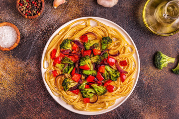 Pasta with broccoli, pepper, onion.