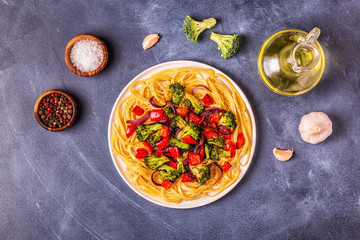 Pasta with broccoli, pepper, onion.