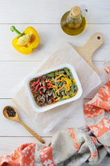 Frozen chicken heart dish with vegetables in a container