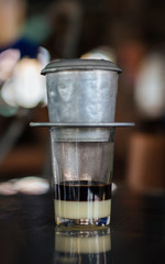 How vietnamese people make traditional black coffee with sweetened condensed milk (Ca Phe Sua)