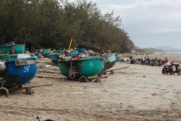 Fisher's village with many traditional vietnamese basket boats on the beach