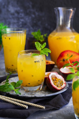 Passion fruit lemonade garnished with lime and mint