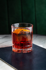 Negroni cocktail on marble table. With space for your text