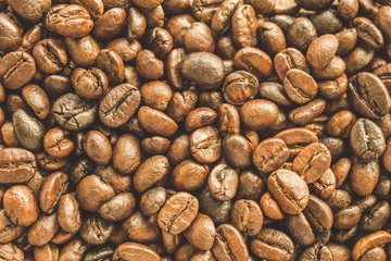 Roasted coffee beans closeup texture background