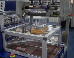 Film package wrapping machine for food jar container