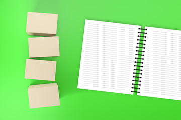 Boxes and Notebook on Colored Background