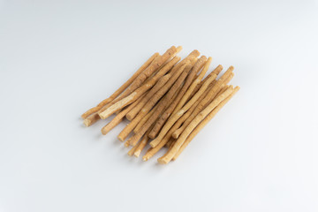 Natural toothbrush Miswak (Kayu Sugi) on white background 