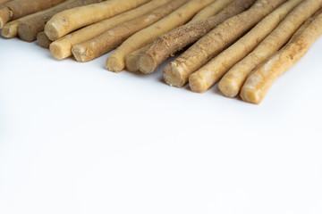 Natural toothbrush Miswak (Kayu Sugi) on white background 