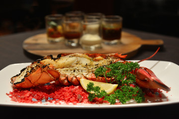 Baked canadian Lobster with Cheese on Plate in Hotel restaurant