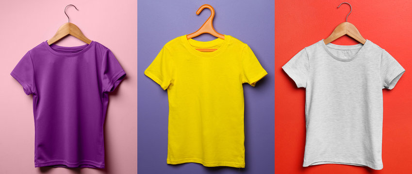 Different child t-shirts on color background