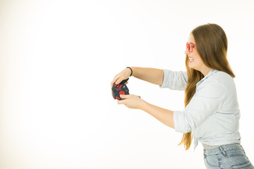 Profile view of woman playing video games