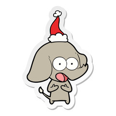 cute sticker cartoon of a elephant wearing santa hat