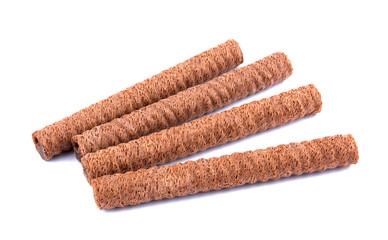 Waffle rolls with chocolate cream on white background
