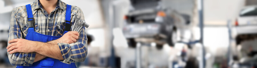 Car mechanic with tools on white background, closeup