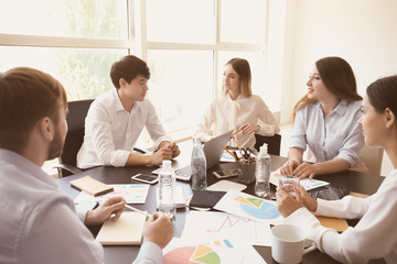 Meeting of business team working in office