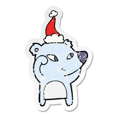 cute distressed sticker cartoon of a bear wearing santa hat