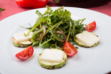 Grilled cheese salad mixed with arugula