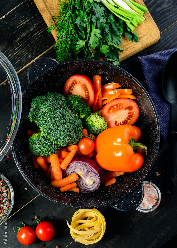 Sticker fresh vegetables in a skillet prepared for stewing