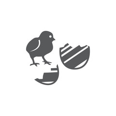 Vector illustration of a chick and two parts of Easter egg. Set of two vector icons. Emergence of a miracle from Easter egg. Flat design Monochrome