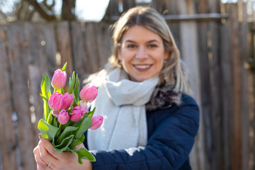 Charming woman with tulips