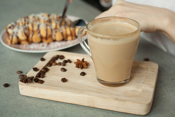 coffee on grey background, coffee and girl's hands