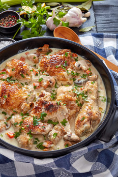hot chicken fricassee in a black dutch oven
