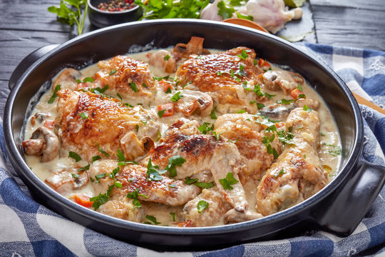 hot chicken fricassee in a black dutch oven