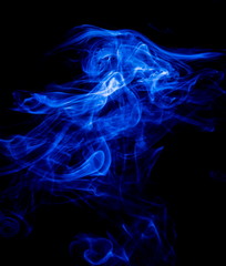 Blue smoke on black background