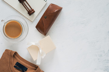 Still life, fashion, business, father's day concept. T-Shirt and frame for father day's greeting on white background. Selective focus, top view, copy space background