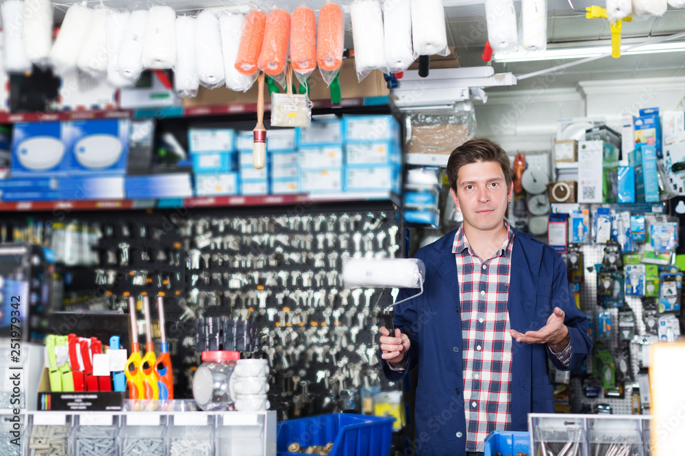 Wall mural man selling rollers for repair