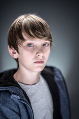 Obraz premium Studio portrait of a handsome and expressive young boy