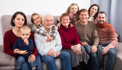 Family with children are posing for photos.