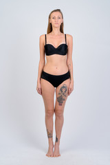 Fototapeta premium Full body shot of blonde woman wearing bikini