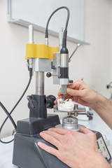 processing dentures cutter manually on the table